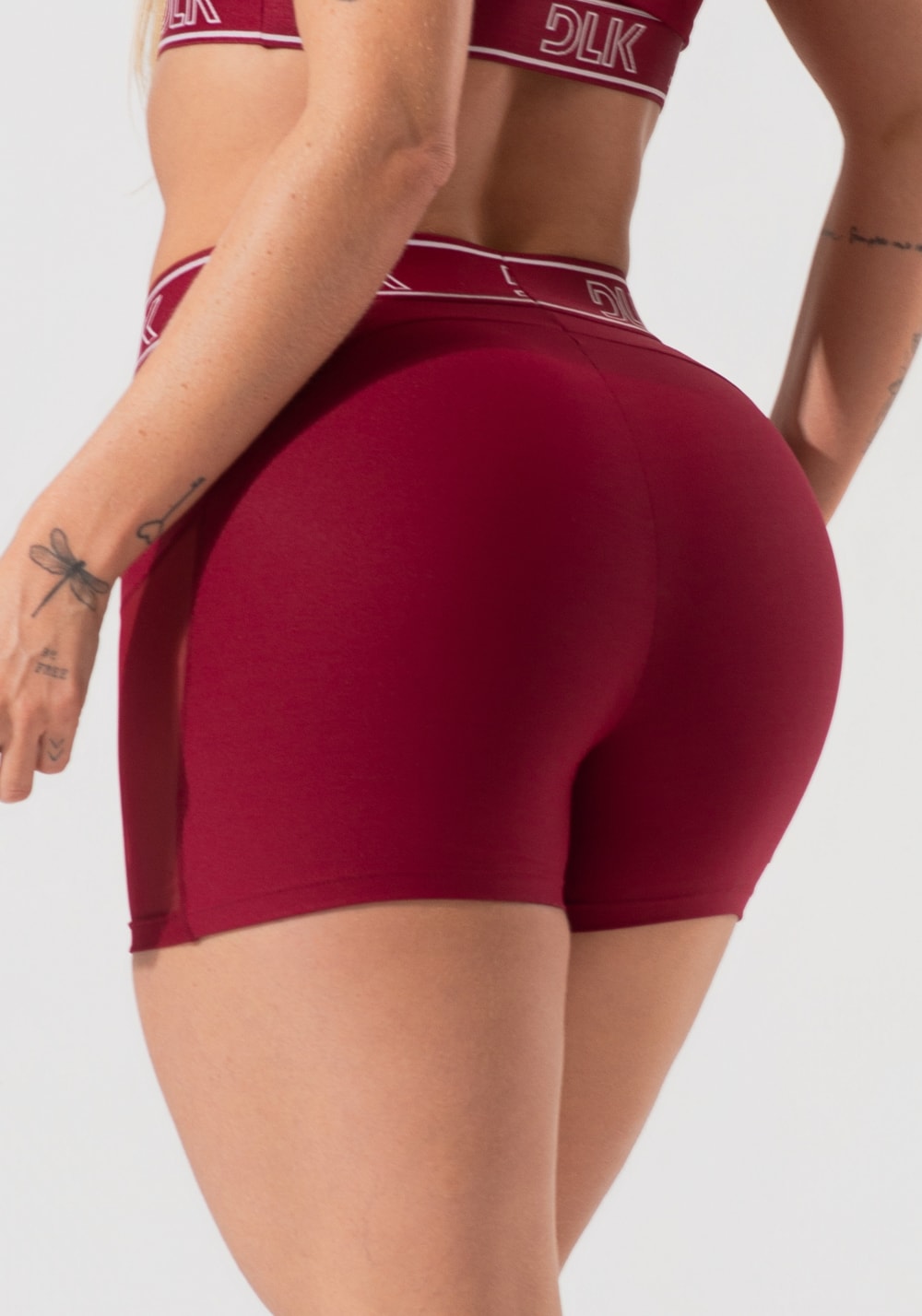 Short fitness feminino com elástico no cós e tule lateral activity dlk vinho